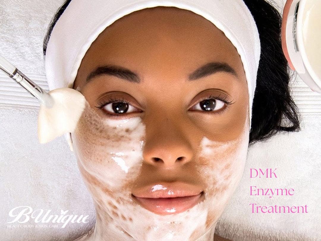 Woman receiving DMK enzyme facial treatment at B-unique spa.